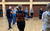 Act Like An Employee. Credit Phoebe Cawley A group of people standing in a circle. They are standing with a finger on their chin and looking up mischievously.