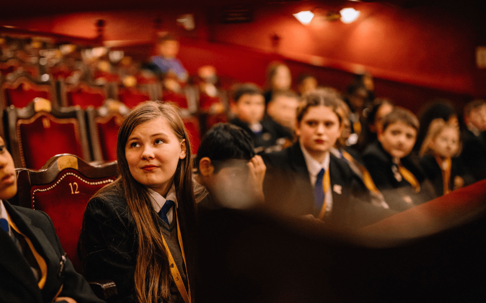 Trinity Academy Leeds students sitting in the auditorium at City Varieties Music Hall.