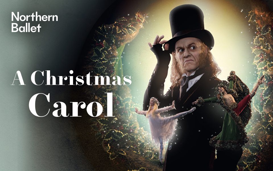 Scrooge in a top hat with a grumpy expression on his face, accompanied by two ballerinas and surrounded by a Christmas wreath. Text reading Northern Ballet. A Christmas Carol.