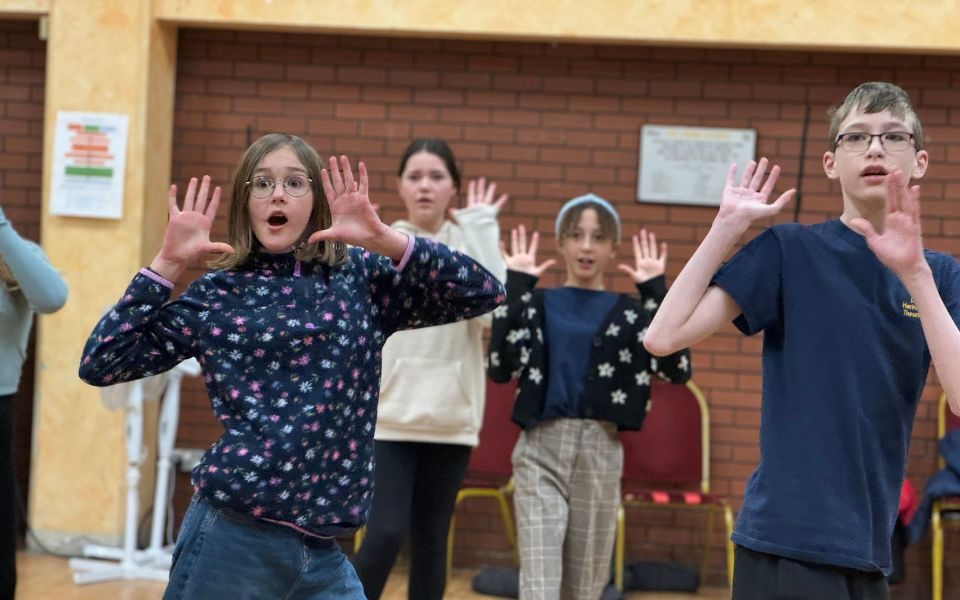 A group of four children acting shocked in our studio during a previous Drama Day.