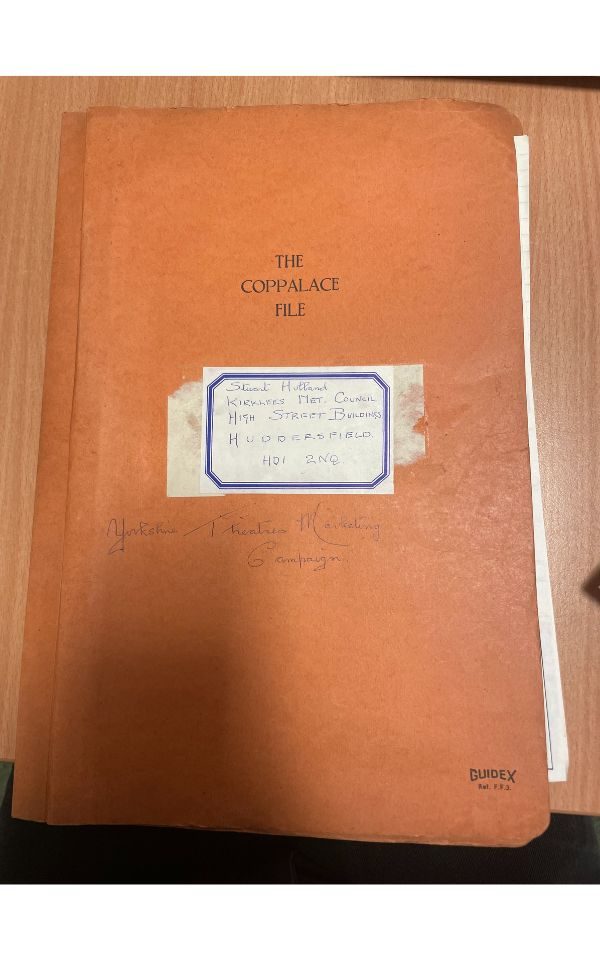 The front cover of the rusty orange booklet that the archive material from the Yorkshire Theatres Marketing Campaign were kept in.