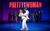 Pretty Woman: The Musical Amber Davies as Vivian Ward and Oliver Savile as Edward Lewis, both wearing white with the logo Pretty Woman: The Musical in red behind them.