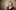 Madi Robinson Image of Madi Robinson from the shoulders up smiling at the camera. She is a woman with blonde hair coming down to just above her shoulders. She is wearing a black top.