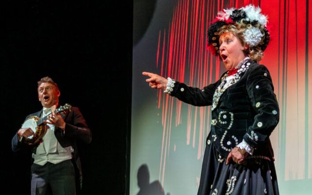 Jan Hunt and Andy Eastwood performing on stage.