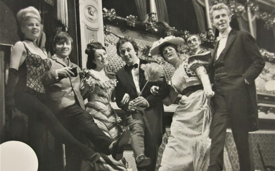 Ken Dodd posing with other performers at The Good Old Days