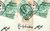 Stamps Three green stamps at askew angles