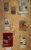 Exhibition by Andrew A corkboard of art pieces with descriptive labels