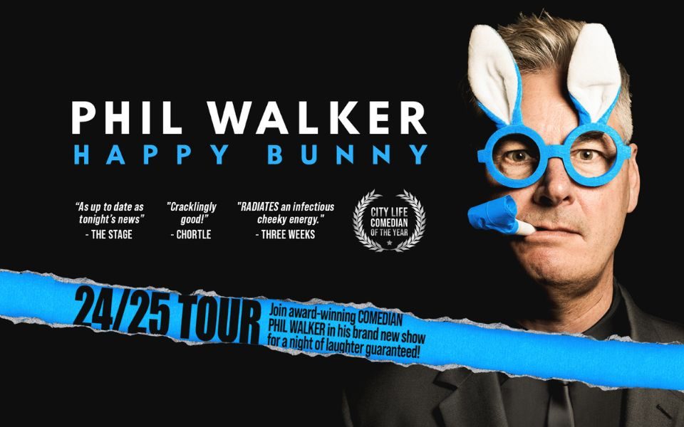 Phil Walker wearing blue glasses that have bunny ears above the rims and a blue party horn in his mouth not blown. Text reads Phil Walker: Happy Bunny. With positive review quotes from The Stage, Three Weeks and Chortle. A crest reads City Life Comedian of the Year and other text reads 24/25 Tour. Join award-winning comedian Phil Walker in his brand new show for a night of laughter guaranteed.