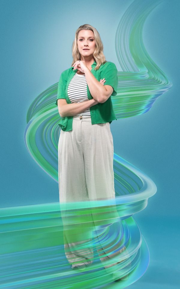 Alice Fearn in light trousers and a green cardigan against a blue background with a stylized green swirl around her.