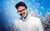 James B Partridge James B Partridge in a white suit, jumper and high neck against a snowy tree scene.