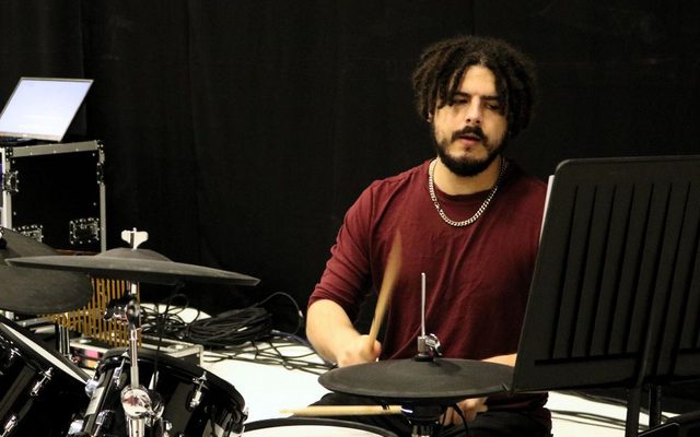 Damien James playing on a drumkit