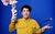 Pete Firman Pete Firman in a mustard-coloured shirt firing a pack of playing cards into the air with his right hand, his left levitating a cord microphone above it.