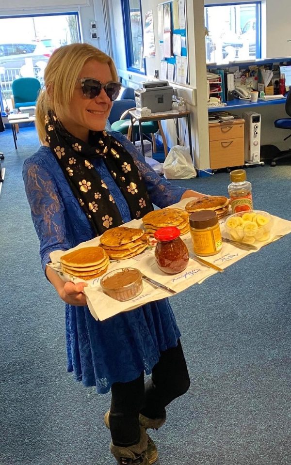 Jo Kenyon holds a tray of sweet treats.