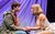 Only Fools and Horses: The Musical Tom Major and Nicola Munns sitting opposite each other and holding hands in Only Fools and Horses: The Musical