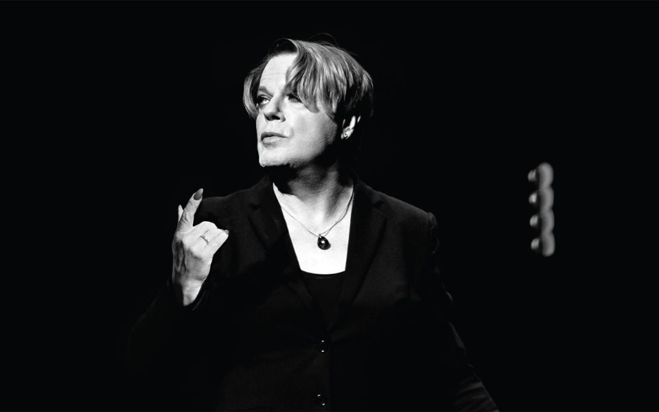 Black and white image of Eddie Izzard on stage during Hamlet.