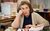 Caroline Quentin Caroline Quentin sat at a desk with her head resting on her hand. She has a script in front of her.