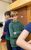 Jasper from LGYT. Credit Lizi Patch A young performer with short blonde hair and wearing a green hoodie crosses his arms and looks into the camera