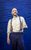 Derren Brown Derren Brown in a white shirt and braces smiling onstage.
