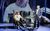 Derren Brown: Only Human An audience member sat in a big armchair looking shocked as his face is also projected onto a big screen behind him. Derren Browns stands next to him laughing.