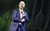 Derren Brown Derren Brown in a blue suit smiling onstage.