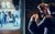 My Beautiful Laundrette Two men stand beneath the glow of a streetlight at the corner of a street