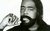 The Legend of Barry White Barry White photographed in black and white, set against a blank backdrop. He has a tight perm and carefully shaped beard, wearing a ring and chain necklace.