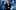 Harry Redknapp in a tuxedo stands smiling in front of a collage of desaturated shots from his life, including Harry on I'm a Celebrity, in a football kit, and on the touch-line as manager.