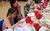 LHT Unwrapped Drama Day 2025 A row of children attending the LHT Unwrapped Drama Day eating their decorated biscuits at a colourful tea party table