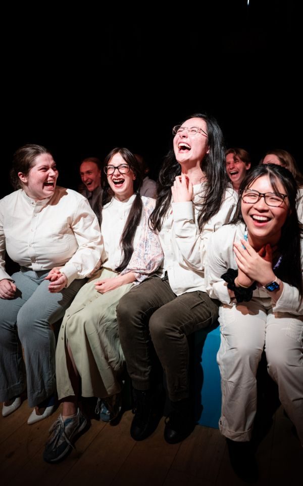 Group of actors laughing together