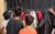 LHT Unwrapped Drama Day 2025 A group of boys with their backs to us pull things off the costume rail at LHT Unwrapped Drama Day