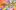 A swirling backdrop of technicolour ribbons surround golden text that reads: Dreamcoat Stars.