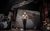 Shock Horror Herbert stood alone on stage, surrounded by elements of a dilapidated cinema