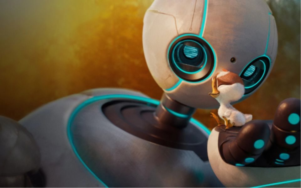 A grey robot with teal detailing and eyes is holding bird in it's hand looking at it up close.