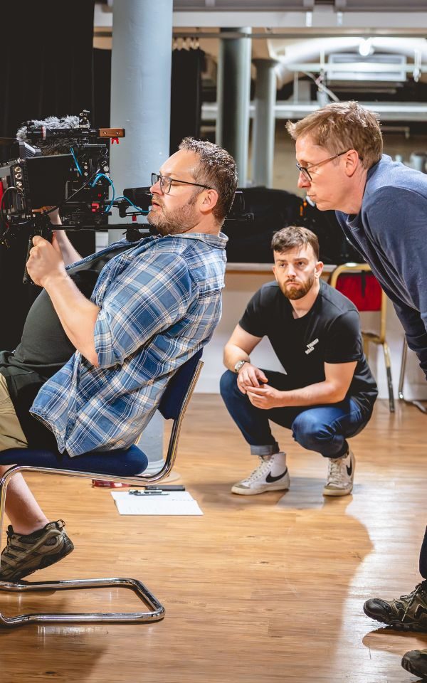 The Thunder Road team in a studio filming