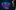 A man's face in profile looks off to the side intently beside a blue backdrop. Neon blue and pink text reads: Entertainers presents In the Air Tonight. A Tribute to Phil Collins and Genesis.