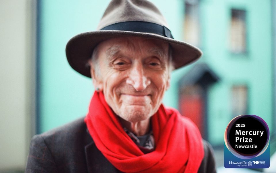 Martin Carthy smiles in a brown trilby hat and red scarf, a blue building behind him. Logo in bottom right reads: 2025 Mercury Prize Newcastle.