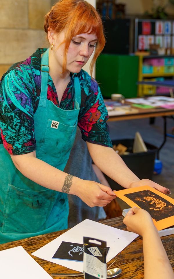 Megan Dobbyn delivering a printing workshop.