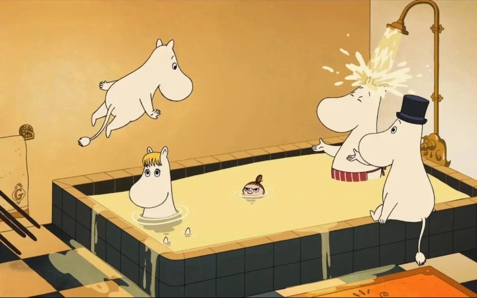 Animated still of the Moomins bathing in a tiled tub. One jumps into the water.