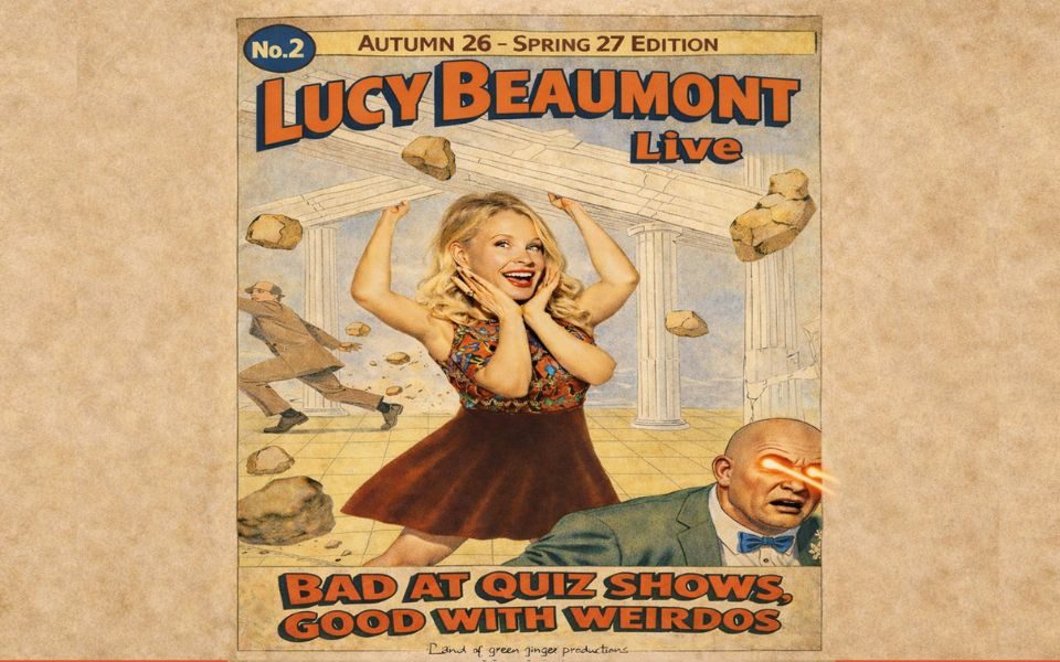Comic book style print, featuring smiling Lucy Beaumont with four arms in a muscle pose and a suited bald man with red lasers shooting from his eyes. Falling rocks and pillars are in the background. Text reads: No. 2. Autumn 26 - Spring 27 Edition. Lucy Beaumont Live. Bad at Quiz Shows, Good with Weirdos.