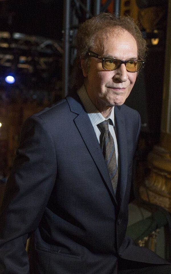 Ray Davies in a dark suit and tie.