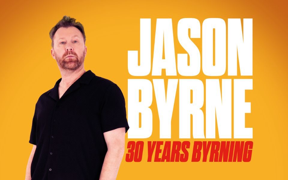 Jason Byrne stands against an orange background looking sternly into camera. Text reads Jason Byrne: 30 Years Byrning