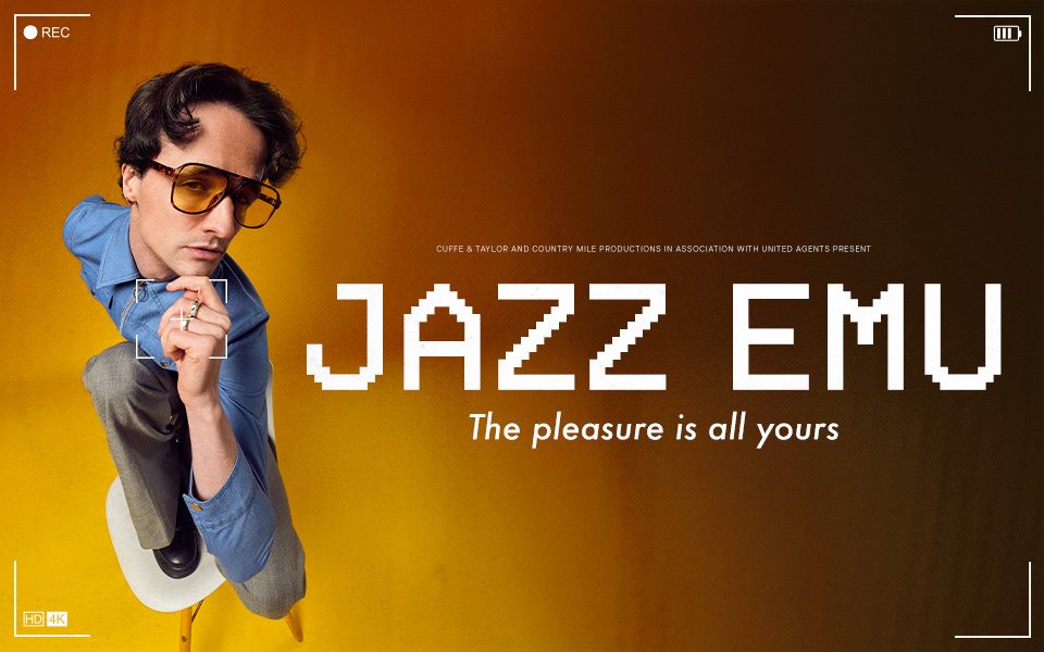 A man in yellow sunglasses and blue shirt poses on a chair and smoulders with two fingers held to his chin. There is a border indicating a digital camera feed, with a battery logo and small 'REC' button. Text reads: Cuff & Taylor and Country Mile Productions in association with United Agents present Jazz Emu: The pleasure is all yours.
