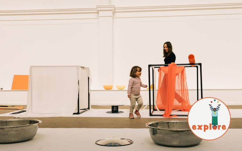 A group of teens dressed in 90s style outfits, baseball caps and trainers, one holding a boombox, crouch and pose in front of a graffitied wall, the text reading: Wild Style. Film Screening of the World First Hip-Hop Movie.