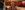 Frank smiles, stood in the Circle at City Varieties Music Hall, the auditorium lit behind him