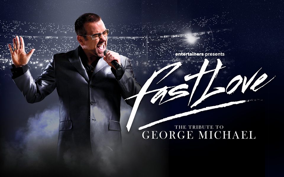 A George Michael tribute artist in a grey suit and sunglasses sings passionately into a microphone, in front of a packed crowd of torches. Text reads: Entertainers presents Fastlove. The Tribute to George Michael.