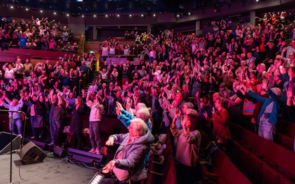A full audience giving a standing ovation at Leeds Playhouse.