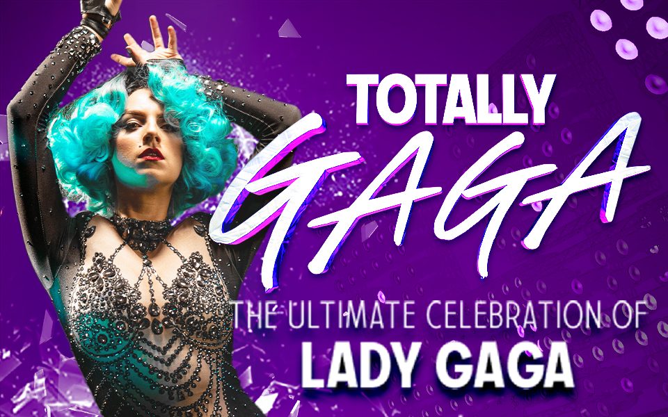 A Lady Gaga tribute artist in a sequined leotard and a blue wig holds a dramatic pose in front of a shimmering purple backdrop. Text reads: Totally Gaga. The ultimate celebration of Lady Gaga.