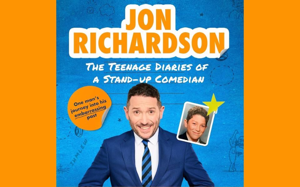 Jon Richardson grinning in a blue suit in front of a school textbook-style backdrop with doodles and a school photo of young Jon. Text reads: Jon Richardson: The Teenage Diaries of a Stand-Up Comedian. One man's journey into his embarrassing past.