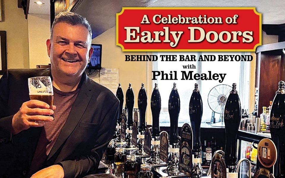 A man stands beside a bar in a pub, cheerily holding up a pint of beer. Text reads: A Celebration of Early Doors. Behind the Bar and Beyond with Phil Mealey.