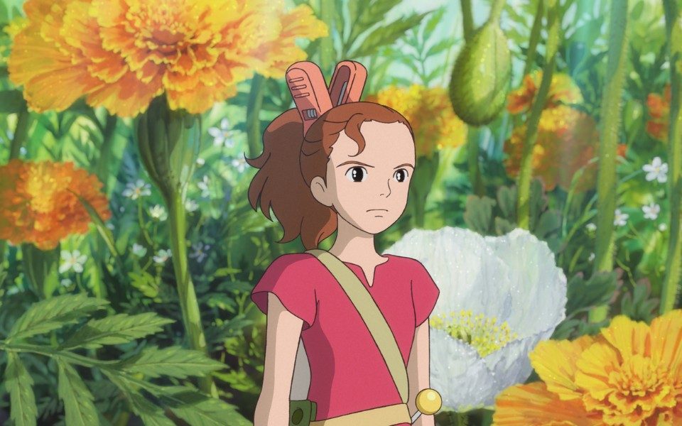 Animated still. A girl with a large hairclip and satchel stands confidently in a garden of over-sized yellow flowers and greenery.